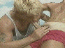 Blond Beach Boy sucks Dick in red Nylon Shorties